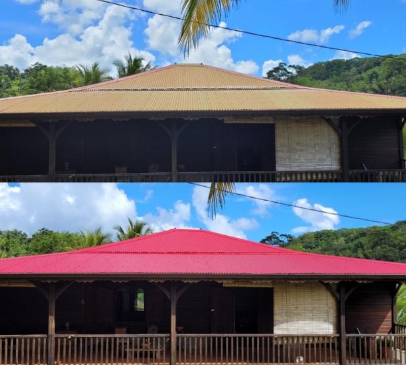 Un artisan appliquant de la peinture sur une toiture en fibro ciment avec soin et précision