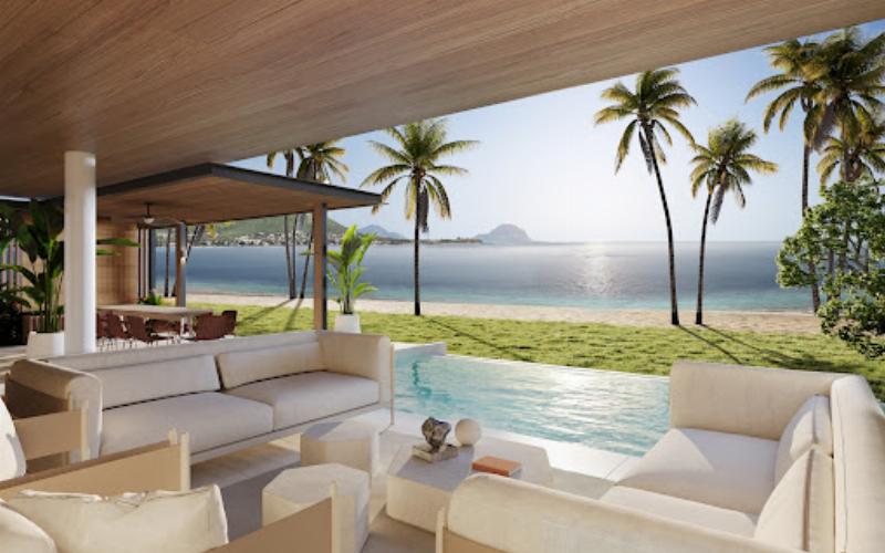 Maison d'architecture moderne tropicale intégrée dans un jardin luxuriant avec piscine