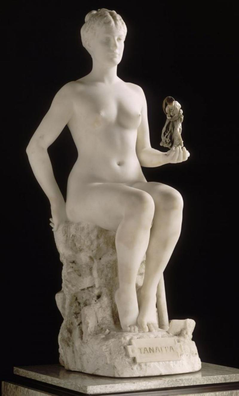 Alt text: Artiste français peignant une œuvre personnalisée avec soin