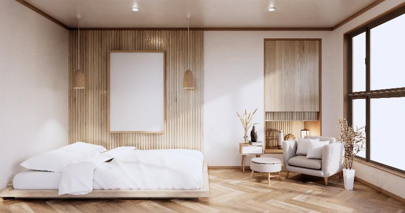 Peinture murale beige doux dans une chambre d'adulte avec lit king size et décoration minimaliste, ambiance sereine