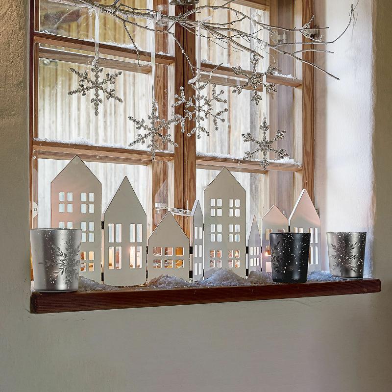 Sculpture stylisée d'un oiseau en bois, aux lignes épurées et modernes.